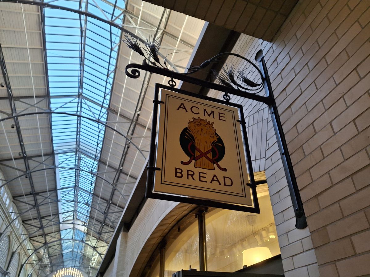 photo of Acme Bread sign in indoor market shot by Galaxy A35