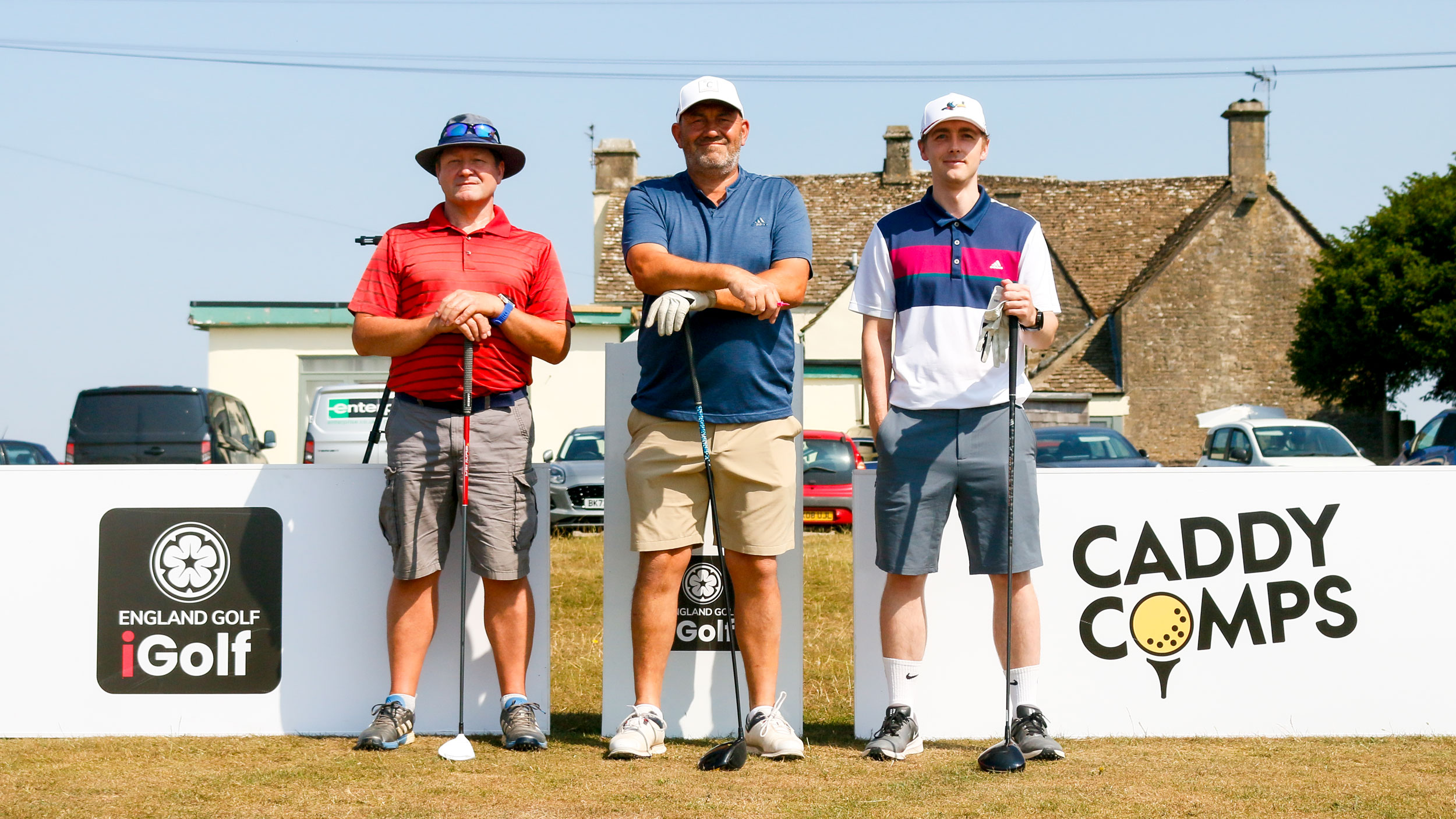 (L to R) Lawrence Kee, Martin Ward and Jonny Leighfield line up on the first at Minchinhampton's Old Course ahead of the 2026 iGolf Open event