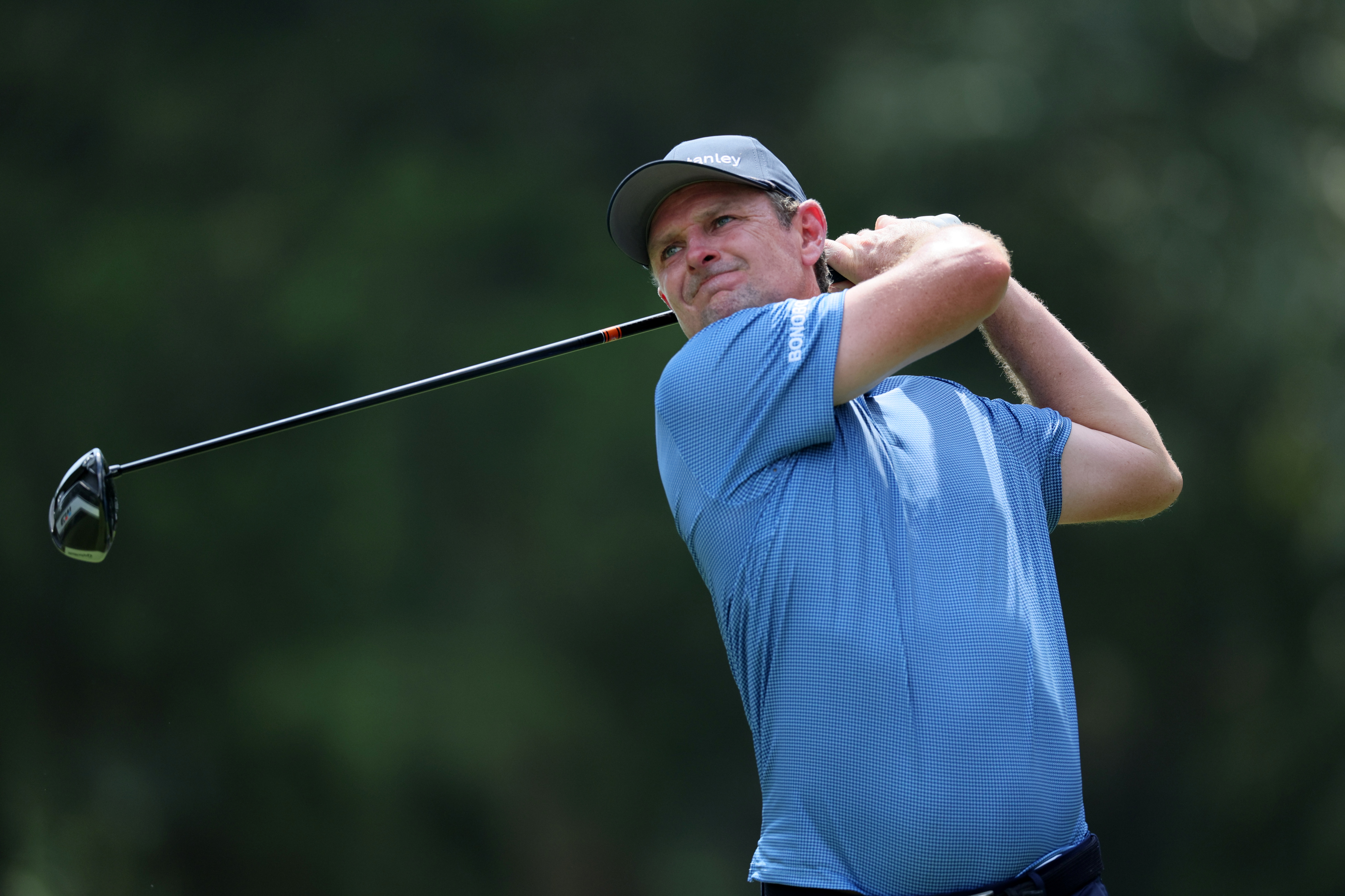 Justin Rose hits a driver