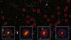 A series of red bubble looking spheres over a dark, starry background with four white cutout squares in the front enlarging four of the bubbles to show glowing balls of red light in each of the bubbles. 