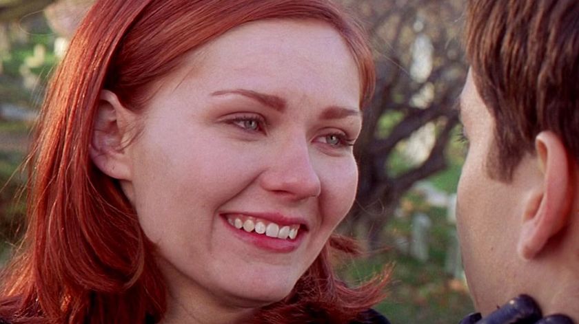 Kirsten Dunst as Mary-Jane smiling looking at Peter Parker in Spider-Man