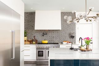White and black geo mosaic tiled backsplash in white contemporary kitchen