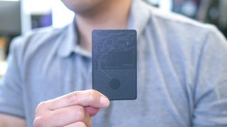 Nomad Tracking Card in hand