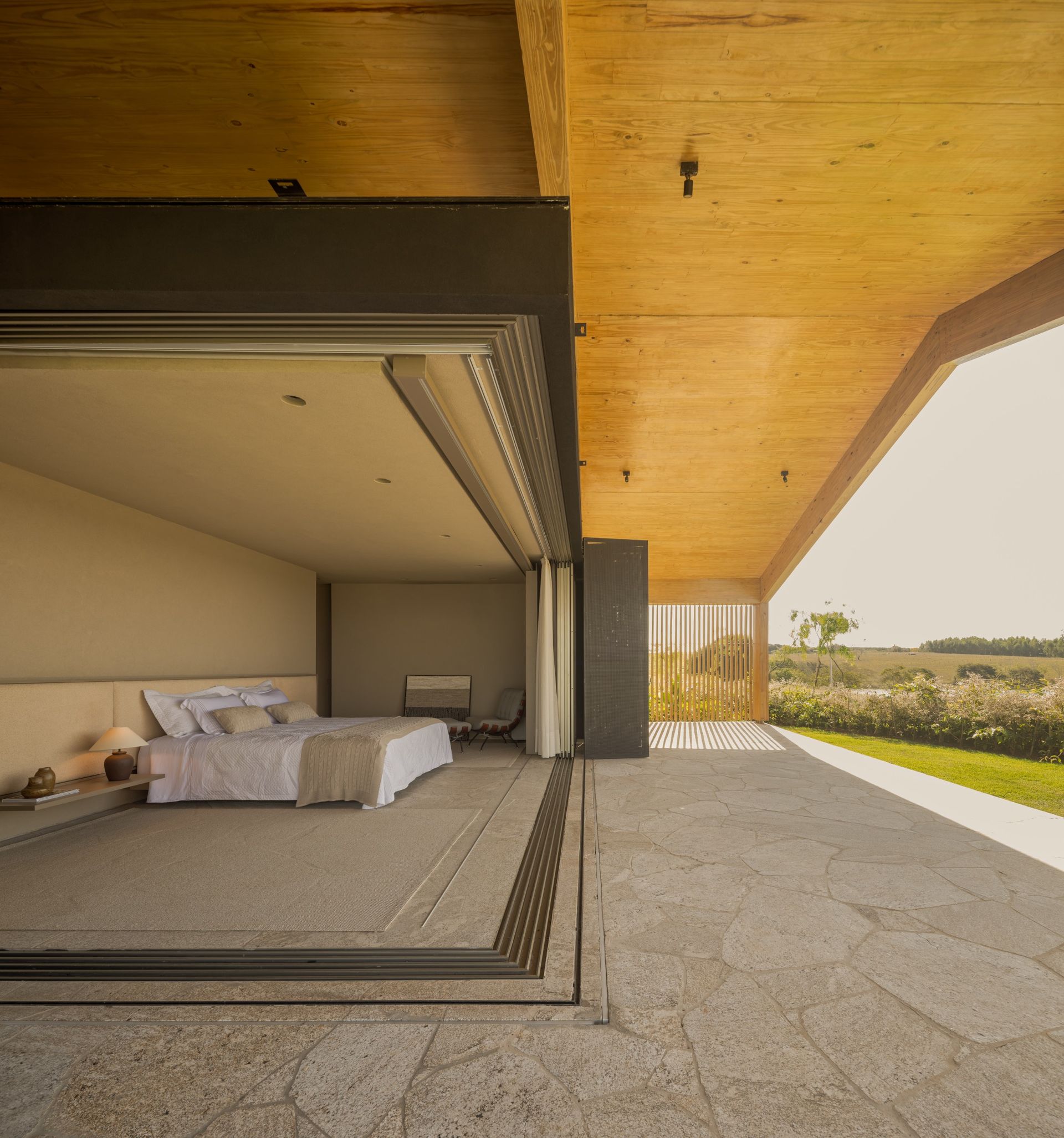 The main bedroom has sliding glass walls