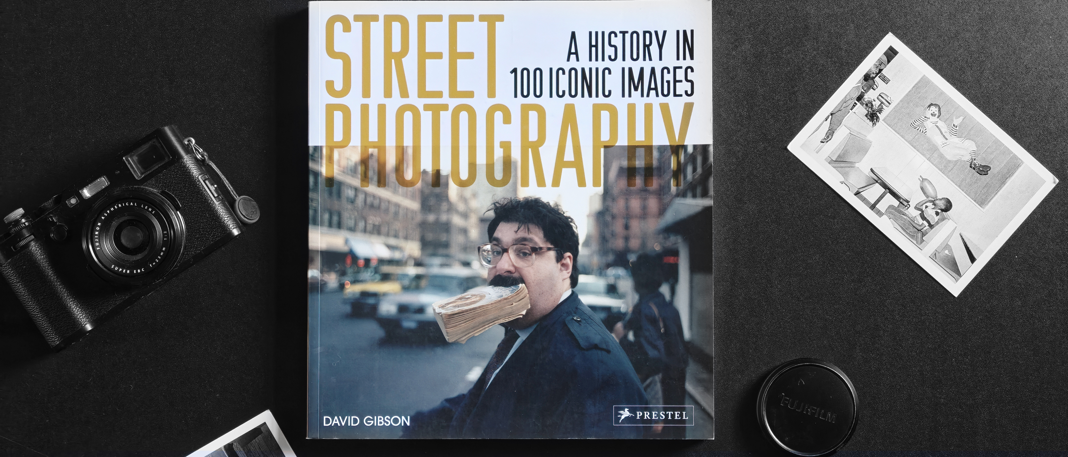 Street Photography: A History in 100 Iconic Photographs by David Gibson