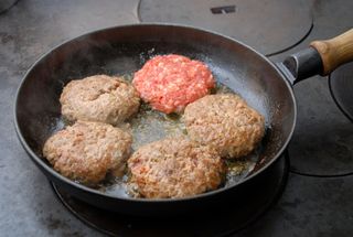 Hamburgers in a frying pan