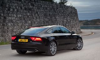 The audi A7 with a swooping rear screen and hatchback and notched tail