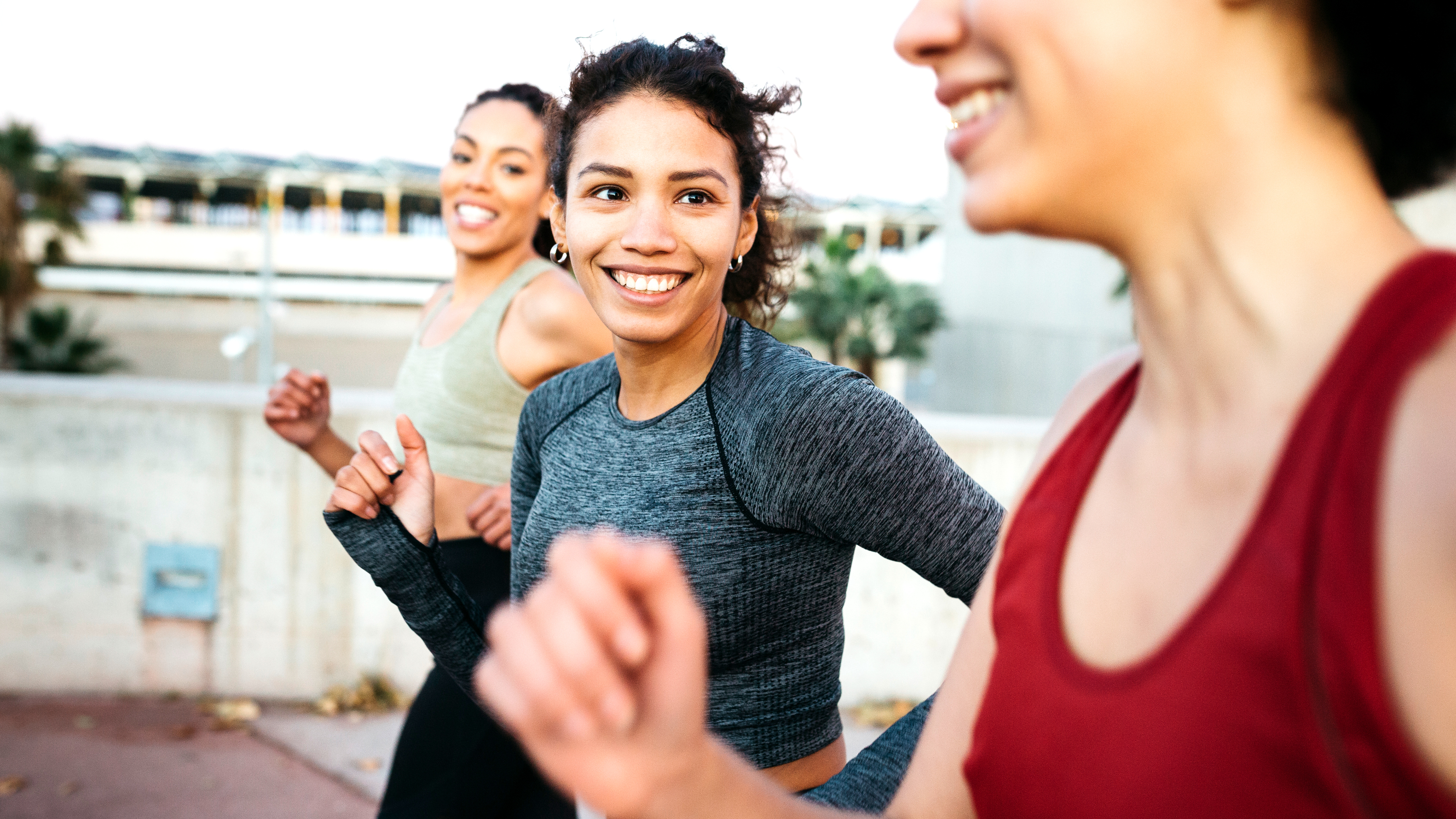 three women running together