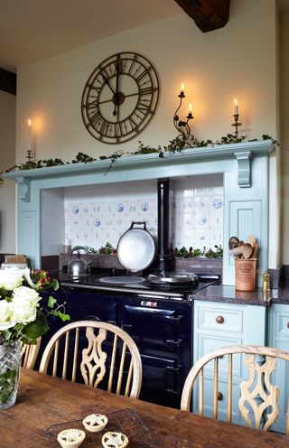 christmas kitchen with blue units and dining room table