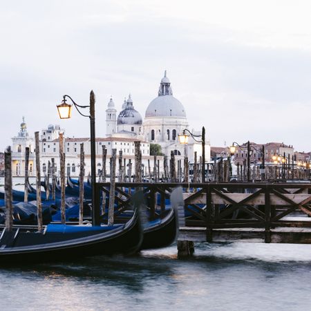 Gondola boats infront of a cathedral in Venice