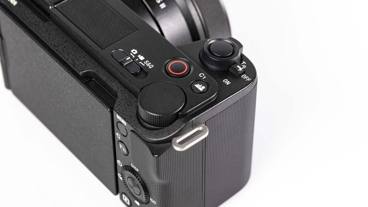 Sony ZV-E10 II on reflective surface and white background