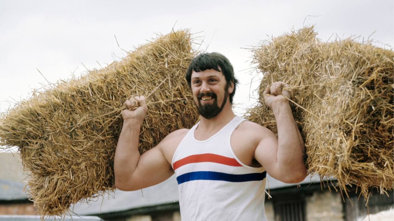 Geoff Capes training, lifting two straw bales