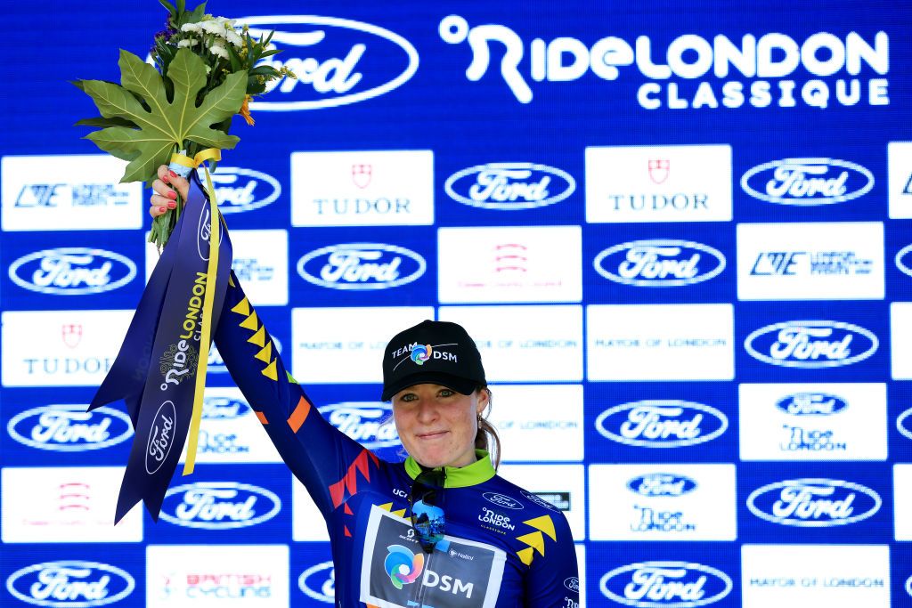 COLCHESTER ENGLAND MAY 26 Charlotte Kool of The Netherlands and Team DSM celebrates at podium as Blue Leader Jersey winner during the 6th RideLondon Classique 2023 Stage 1 a 1464km from Saffron Walden to Colchester UCIWWT on May 26 2023 in Colchester England Photo by Stephen PondGetty Images