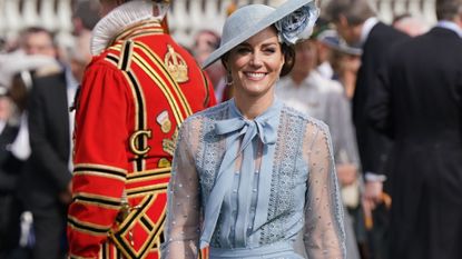 The Princess of Wales wears a pale blue blouse and skirt with matching fascinator at the King's Coronation Garden Party