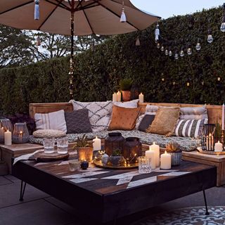 outdoor seating with lighting and candle