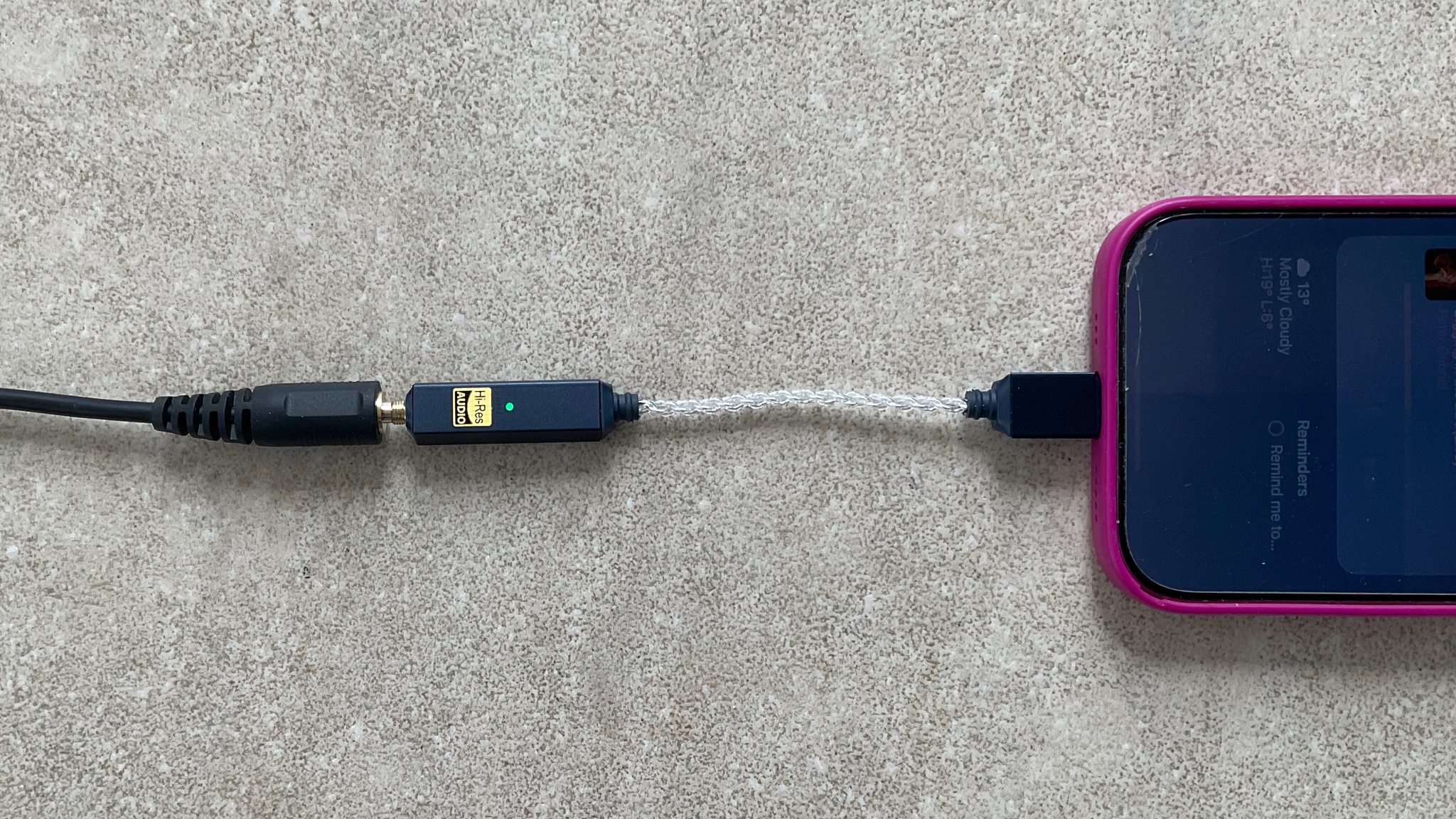 iFi GO Link 2 shot on a grey surface