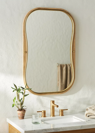 Wood and resin irregular shape wall mirror from Anthropologie.