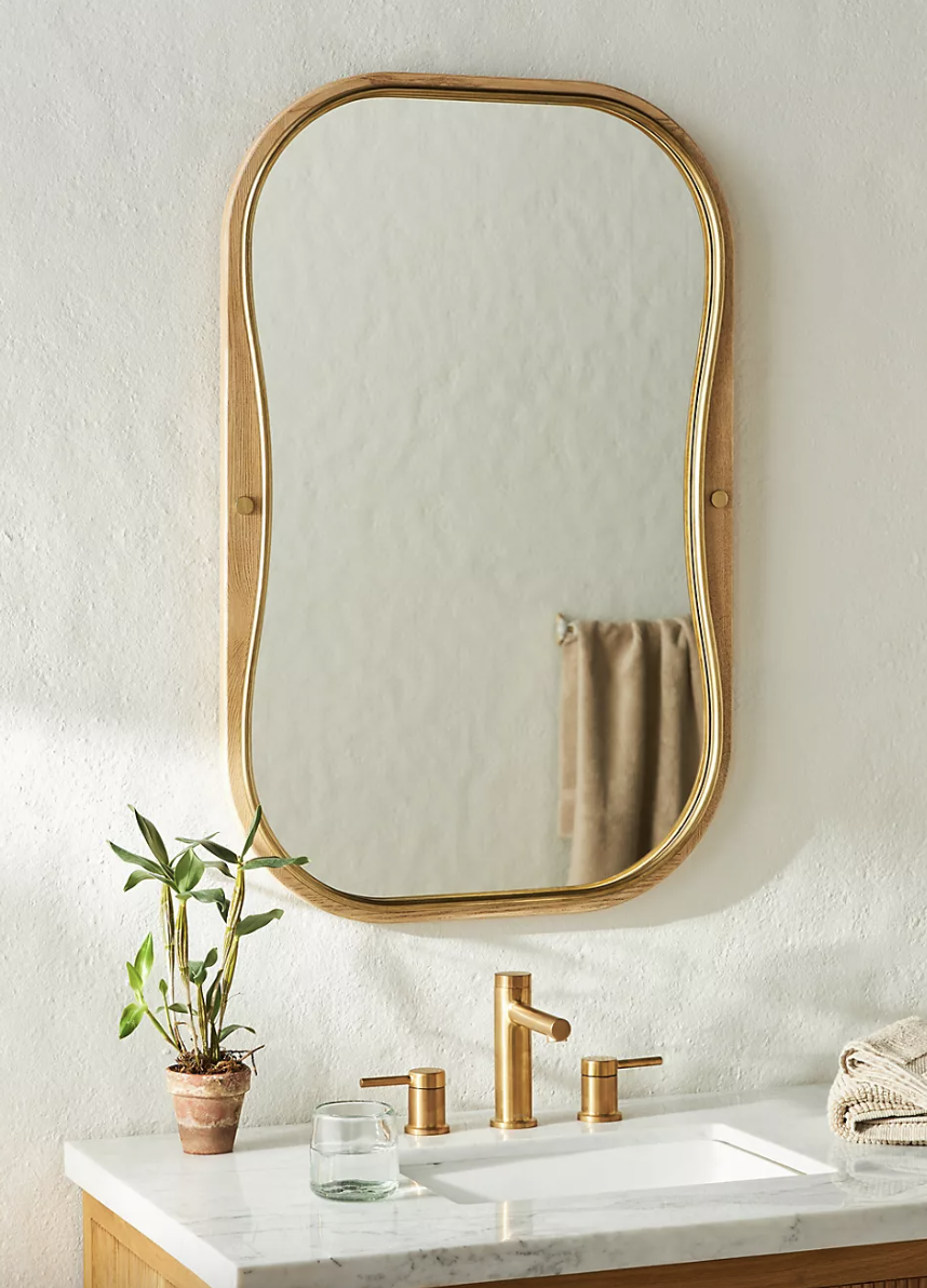 Wood and resin irregular shape wall mirror from Anthropologie.