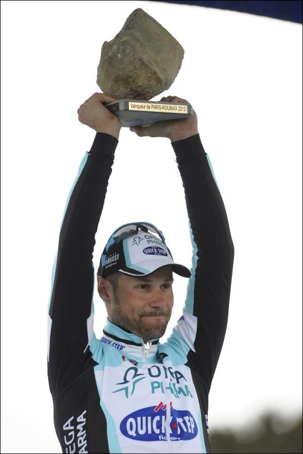 Tom Boonen (Omega Pharma-QuickStep) holds the Paris-Robaix trophy aloft for a record-equalling fourth time