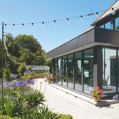 Festoon outdoor lights hanging outside house exterior