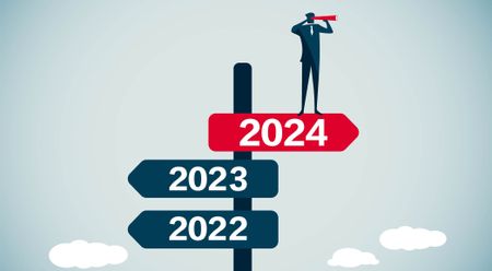 signpost pointing to 2024 prediction with 2023 and 2022 in the opposite direction