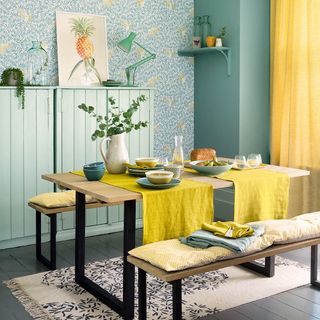dining room with wooden floor and leafy wallpaper wall