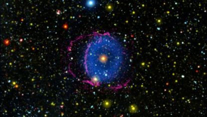 The Blue Ring Nebula is believed to have formed after a stellar collision, which ejected a cloud of hot debris into space. These emissions appear to form a ring around the nebula's central star, as the outflow of material forms a cone shape and the base of one of the cones is oriented almost directly toward Earth.