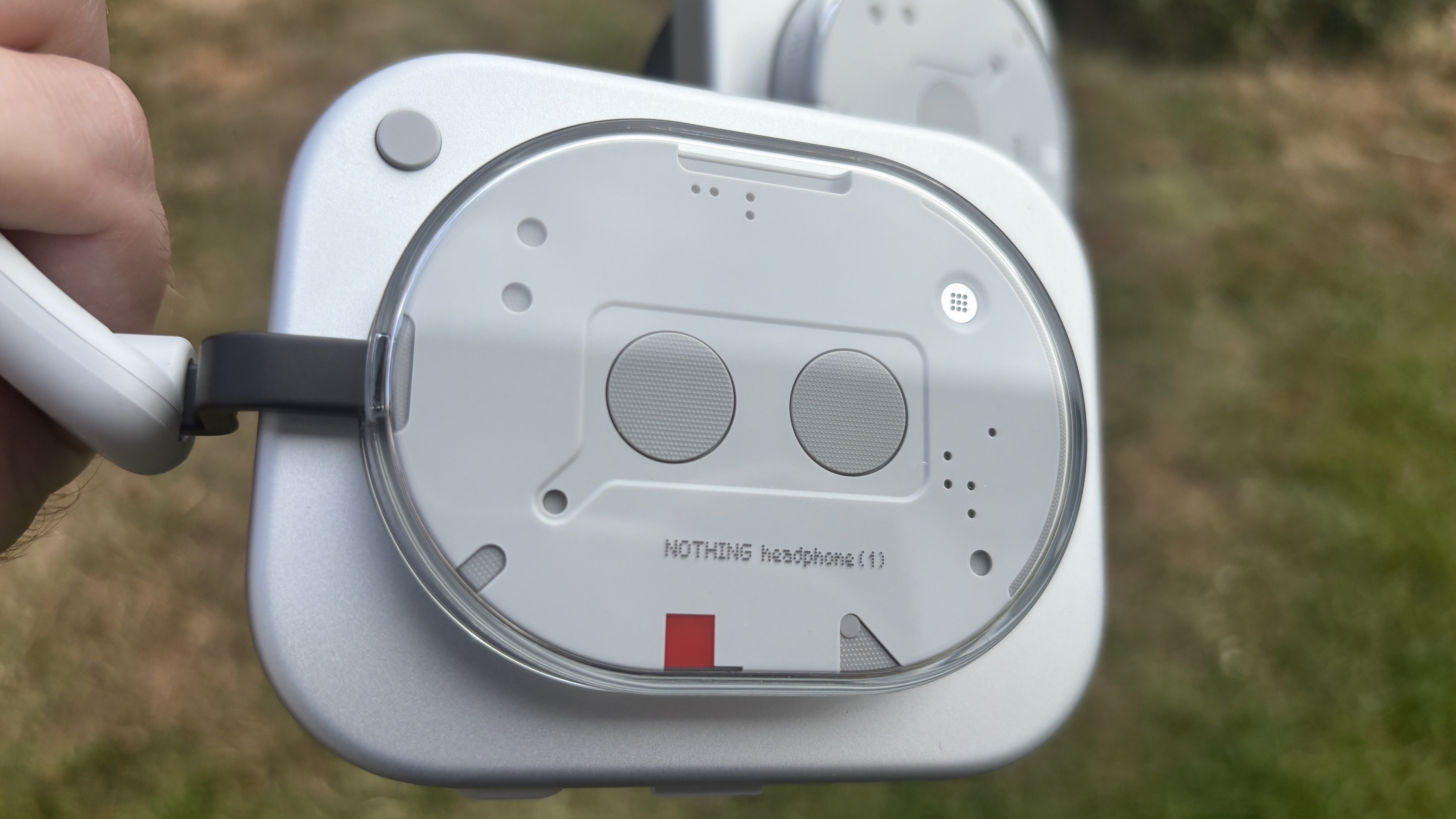Nothing Headphones (1) in white earcup closeup