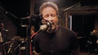David Duchovny performing in a music video