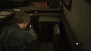 Resident Evil 2 remake locker codes - Leon looks at an opened safe