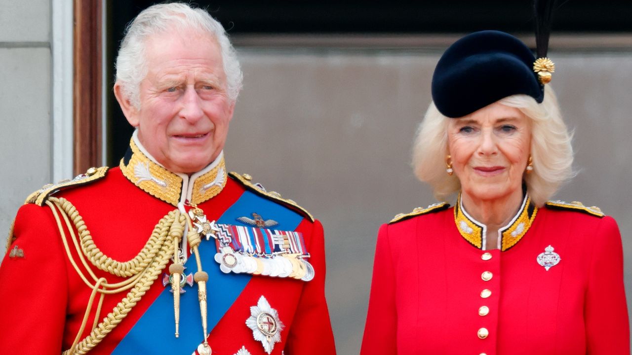 King Charles’ sign of equality with Queen Camilla explained. Seen here King Charles and Queen Camilla watch an RAF flypast