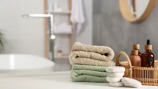 White bathroom with colourful towels