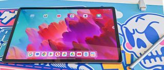 Lenovo Idea Tab Pro home screen with stylus on a graffiti style mat