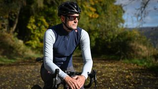 Castelli Espresso Vest in dark blue being warn by a stationary male cyclist