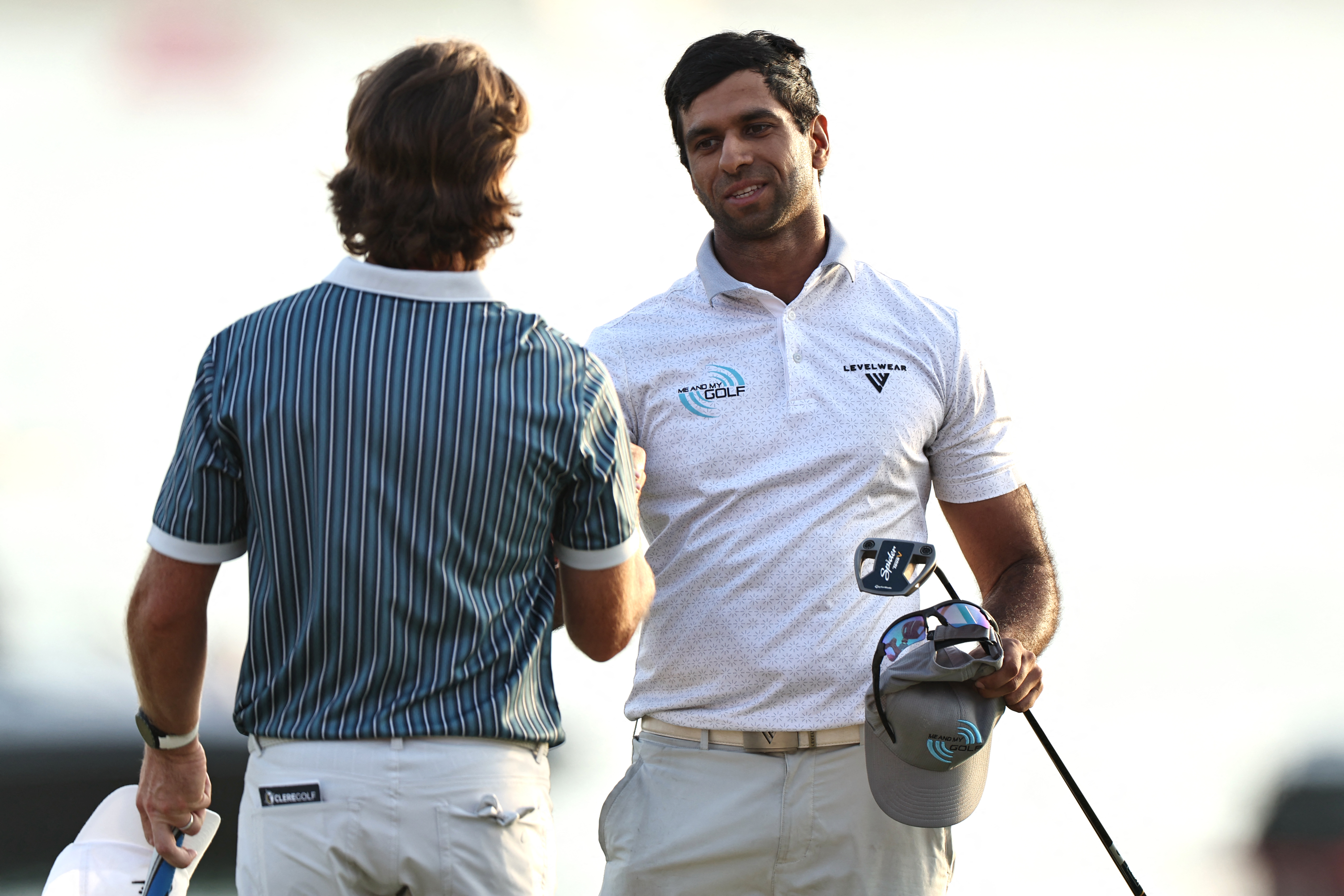 Aaron Rai shakes hands with Tommy Fleetwood