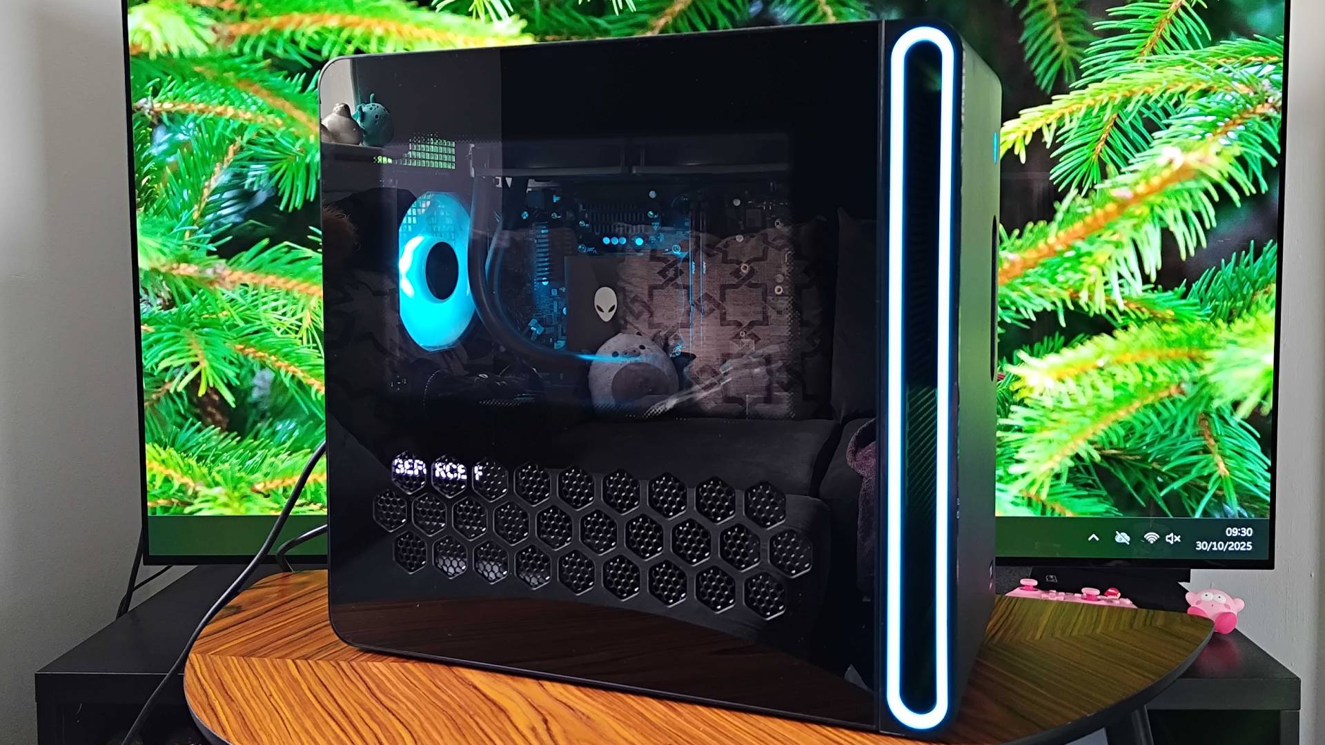 Side view of Alienware Aurora 2025 PC with glass side panel in view.