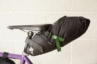 Miss Grape Cluster 7 Waterproof Seatpost Bag which is one of the best bikepacking bags