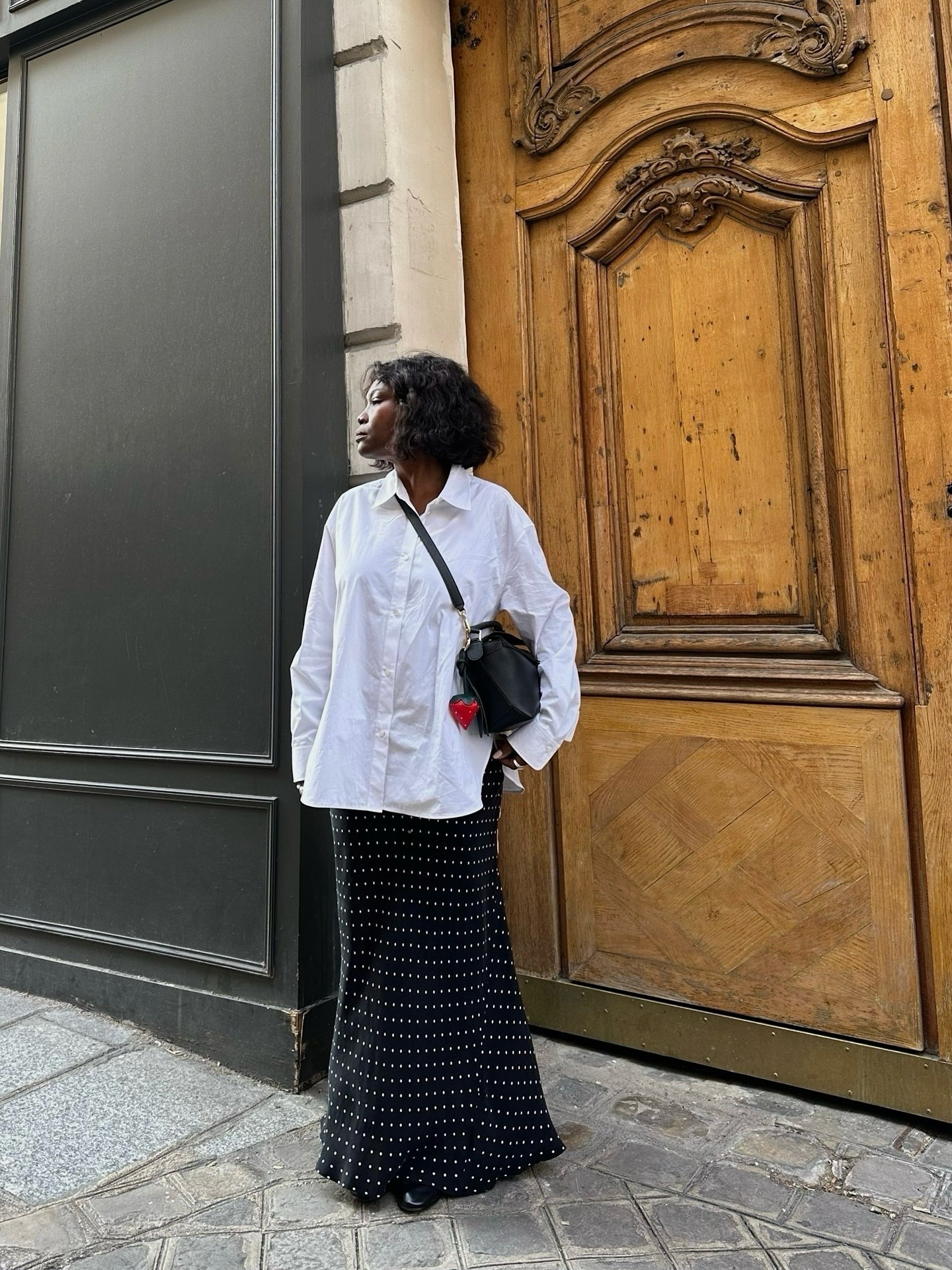 woman in shirt and polka-dot skirt