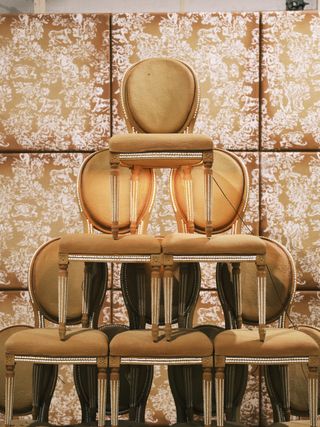 Stack of Dior medallion chairs made from gingerbread