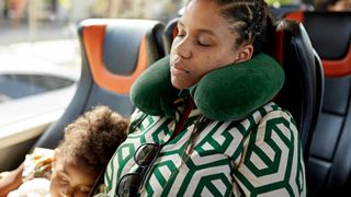 woman using travel pillow