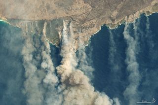 On Jan. 9, 2020, the Operational Land Imager on the NASA-USGS Landsat 8 satellites acquired natural-color images of charred land and thick smoke covering Australia’s Kangaroo Island, where nearly one-third of the land area had burned.