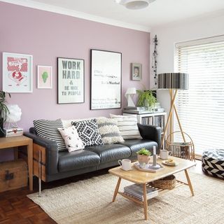 pink wall with wooden table and tea cup
