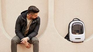 Man with cat in one of the best cat backpacks