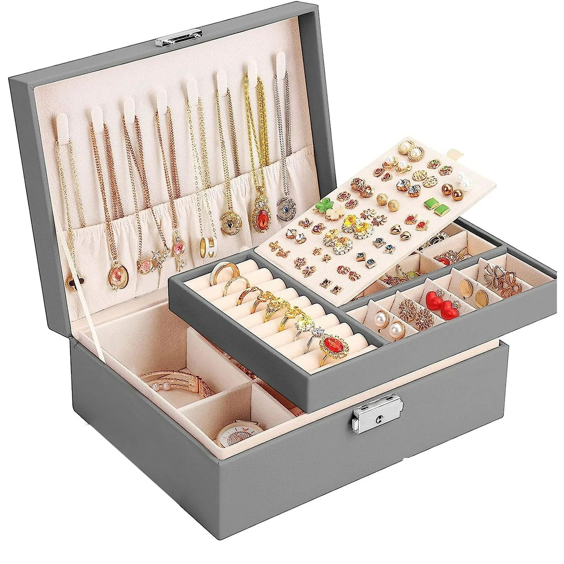 A grey open jewelry box filled with multicolored jewelry
