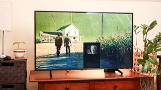 Samsung DU8000 LED TV on console in living room