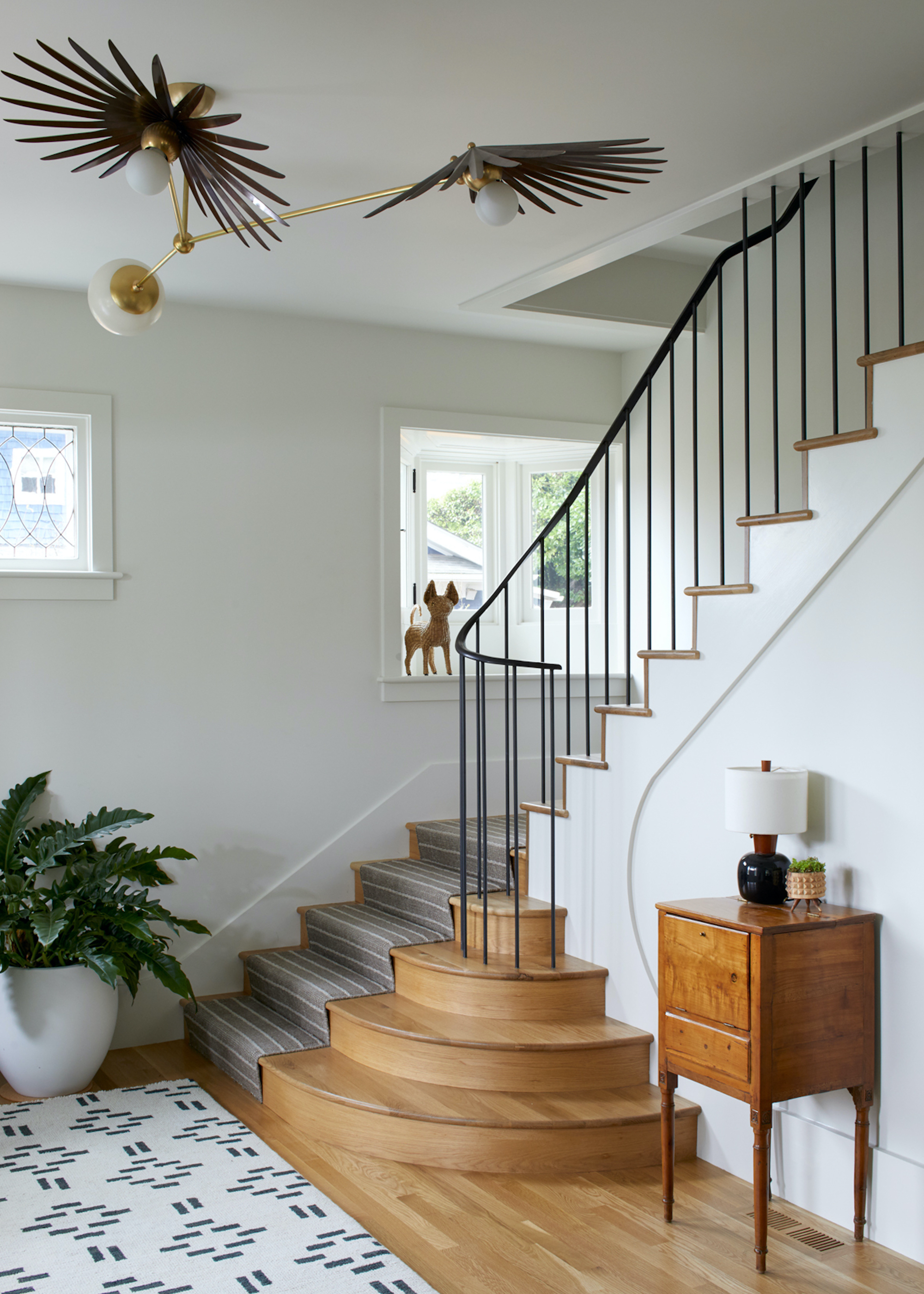 staircase with wood treads and grey runner