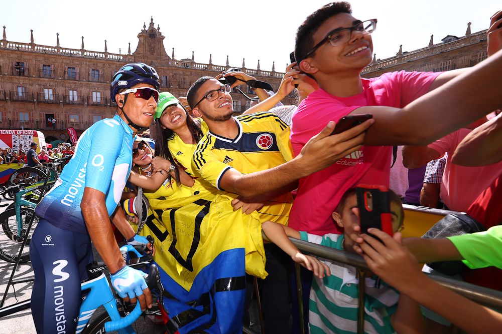 Nairo Quintana takes time for a photo with fans before the start of stage 10 at the Vuelta
