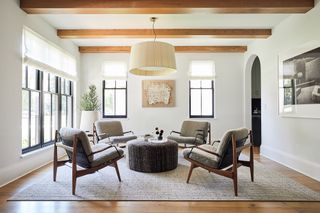 Neutral reception room with midcentury furniture