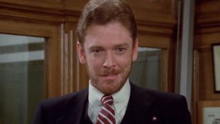 William Atherton wearing a suit and smiling