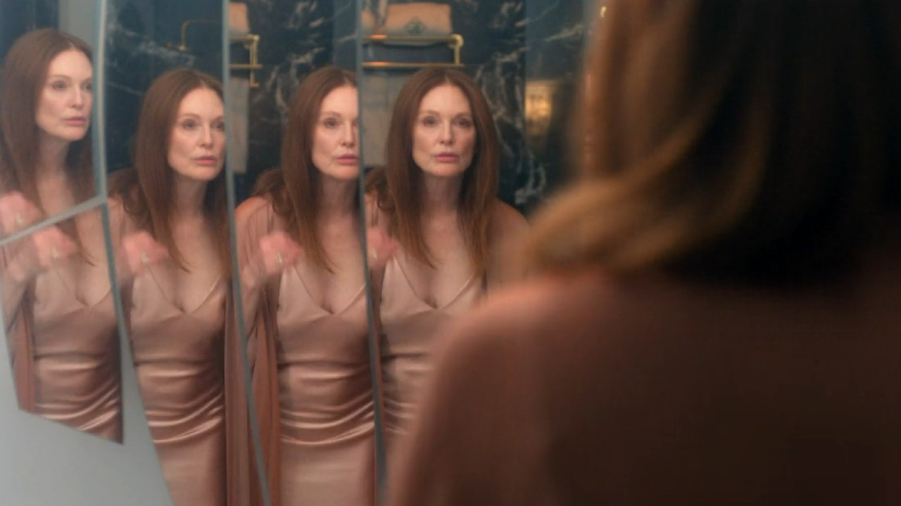 Julianne Moore looking in multilayered mirror in Sirens.